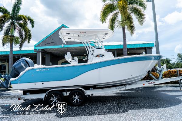 Sea Fox 248 Side Console 2024 Sea Fox 248 Side Console boat on trailer, displayed outdoors.