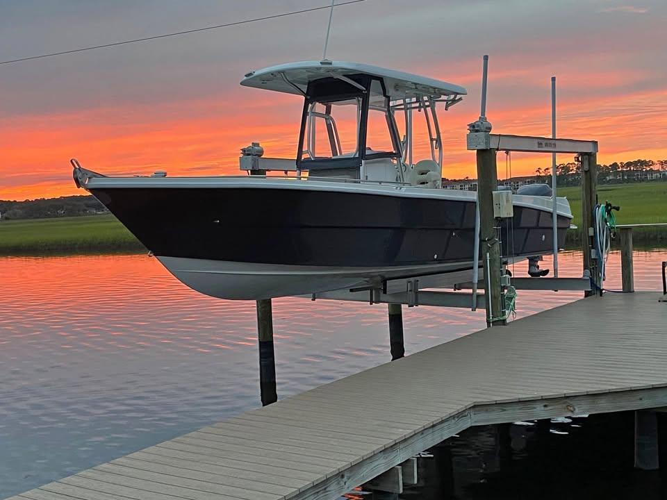Custom Shark Fin R321 Custom Shark Fin R321 boat docked at sunset, 2025 model.