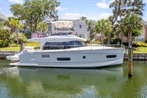 Azimut Magellano 43 2014 Azimut Magellano 43 yacht docked in a scenic residential canal.