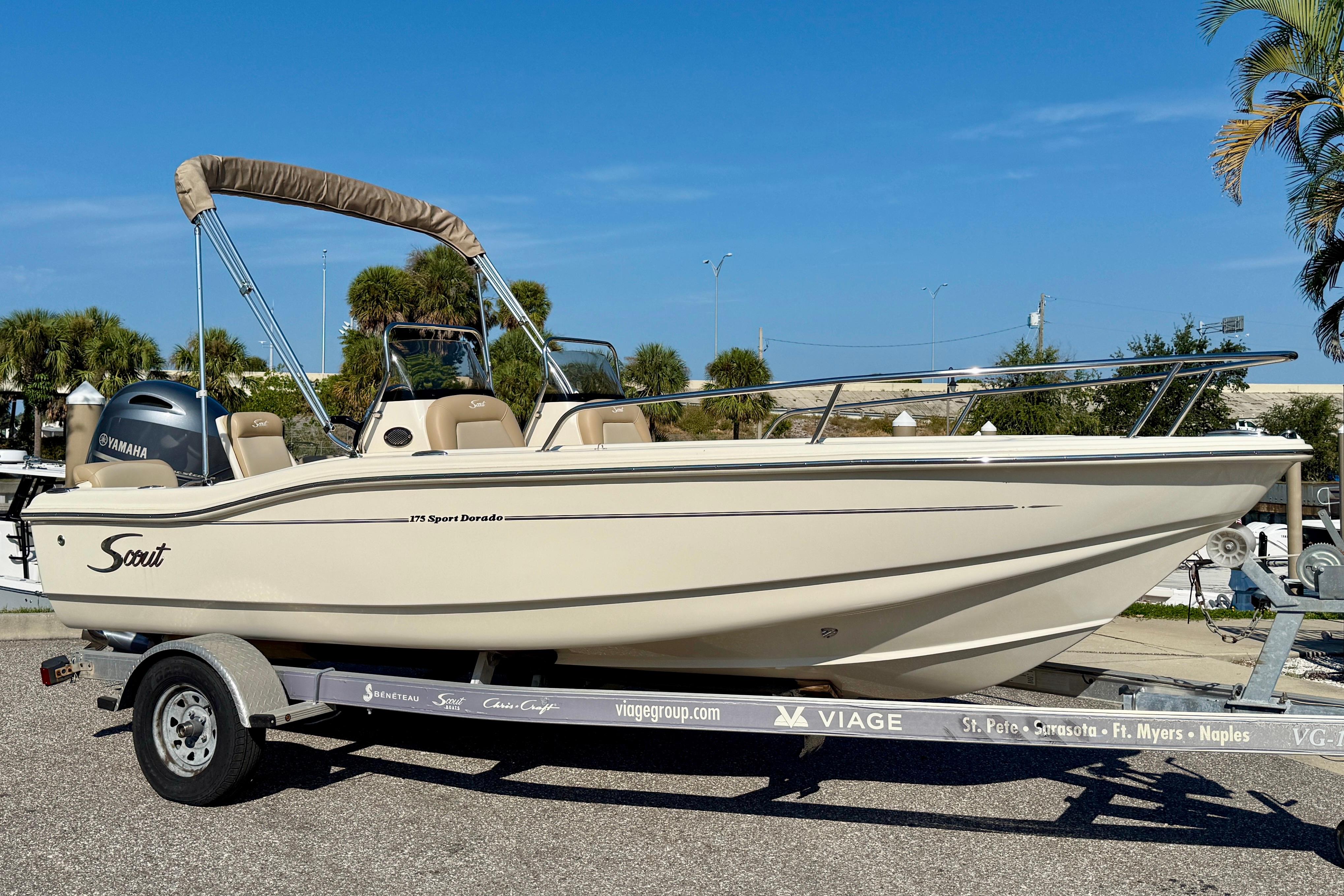 Scout 175 Sport Dorado 2024 Scout 175 Sport Dorado boat on trailer, featuring Yamaha engine, parked outdoors.