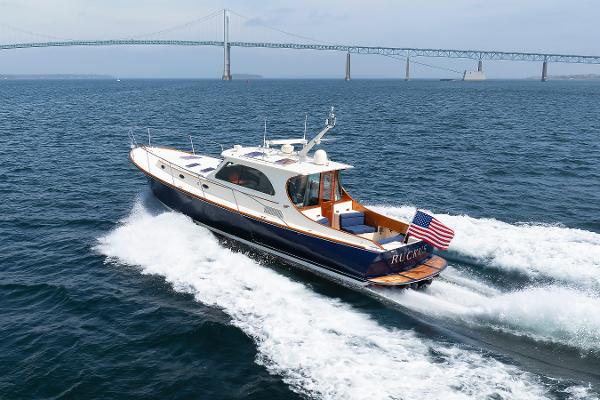 Hinckley Talaria 44 MY Hinckley Talaria 44 MY 2009 cruising on open water with bridge in background.