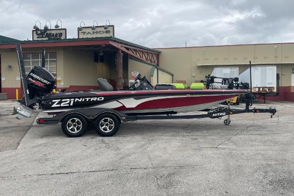 Nitro Z21 XL Pro 2016 Nitro Z21 XL Pro bass boat on trailer, parked outside a building.