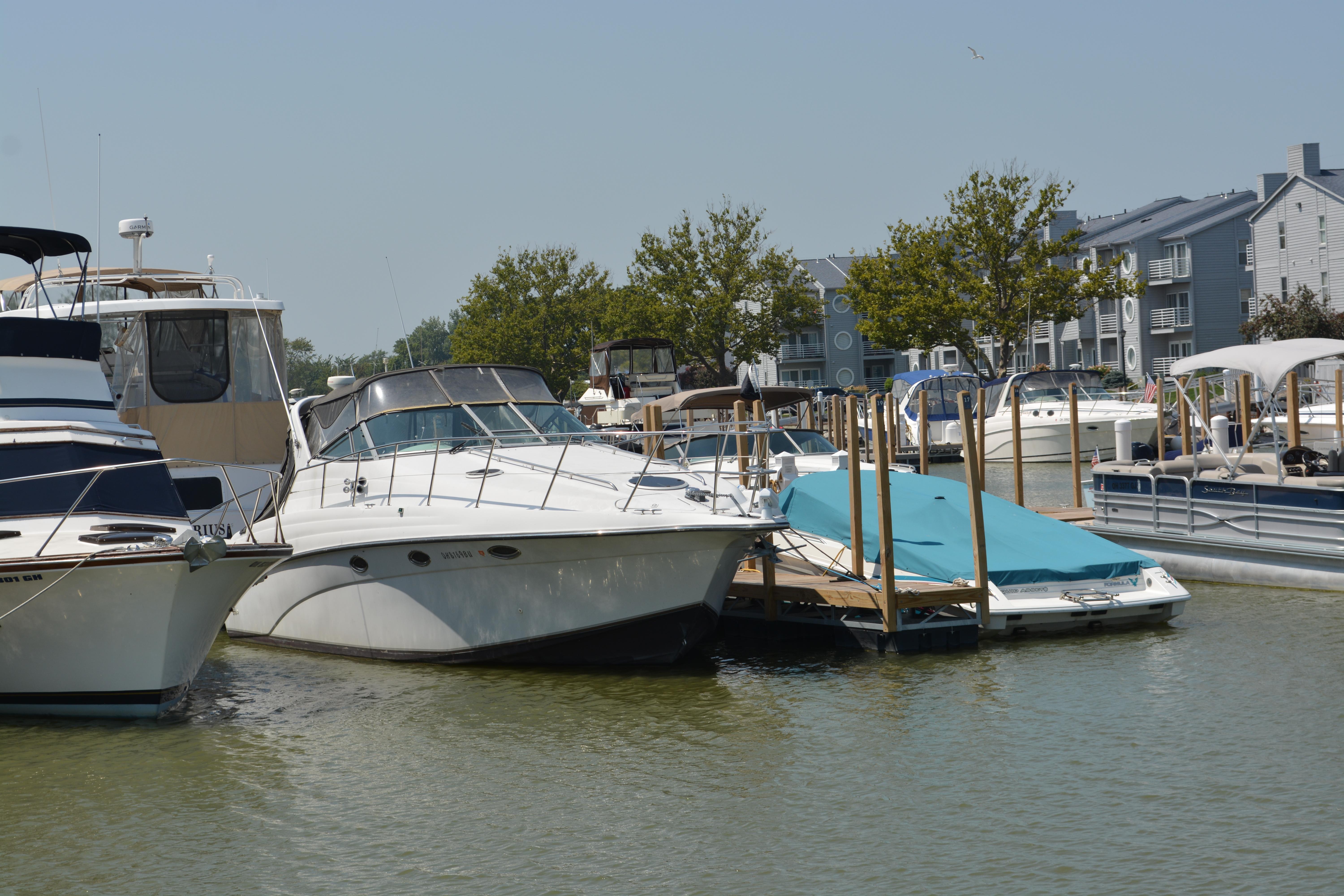 Crownline 330 CR Boats docked at a marina, featuring a 1997 Crownline 330 CR.