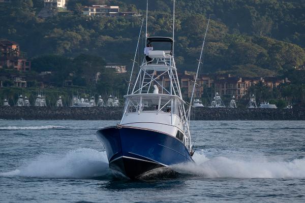 Maverick Yachts Costa Rica 50 2025 Maverick Yachts Costa Rica 50 cruising on water with lush green hills in background.