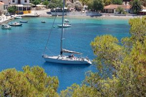 Comar COMET 50 CL Sailboat Comar COMET 50 CL 2004 anchored in a scenic bay with clear blue water.