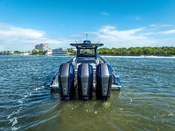 Nor-Tech 450 Sport Center Console 2024 Nor-Tech 450 Sport Center Console boat with triple engines on open water.