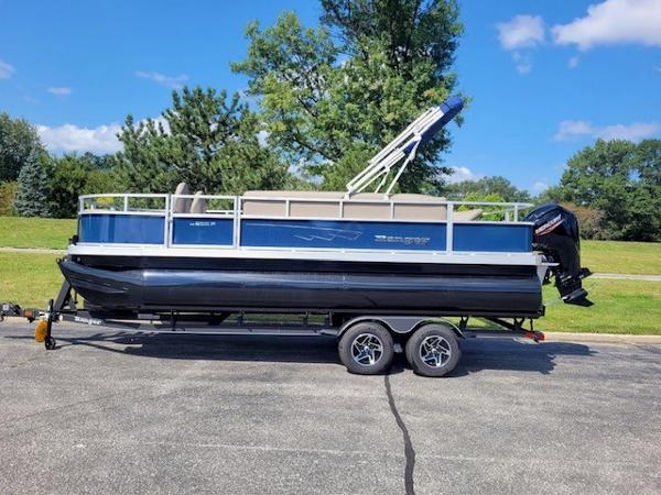 Ranger Reata 200F 2024 Ranger Reata 200F pontoon boat on trailer, parked outdoors.