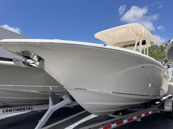 Key West 260 CC 2025 Key West 260 CC boat on trailer under clear blue sky.