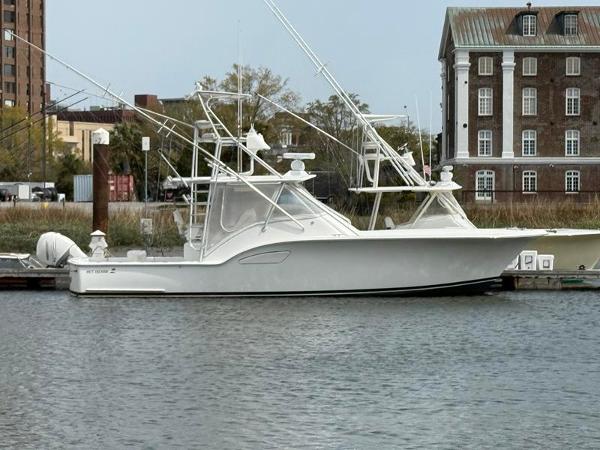 Out Island 38 Express Fisherman 2005 Out Island 38 Express Fisherman docked near historic buildings.