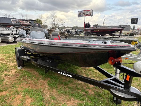 Falcon F205 2025 Falcon F205 boat on trailer, displayed outdoors at a dealership.