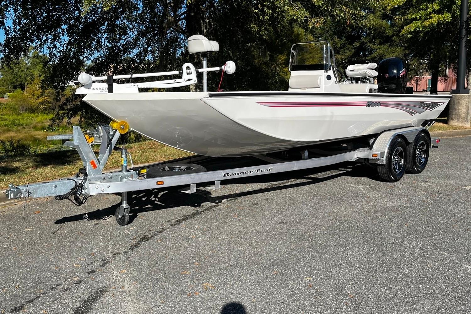 Ranger RB200 2024 Ranger RB200 boat on trailer, parked outdoors, side view.