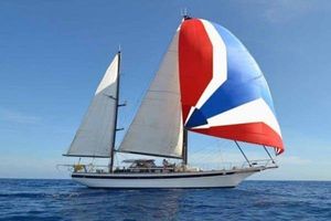 Jongert 19 S 1980 Jongert 19 S sailboat with colorful spinnaker on open sea.