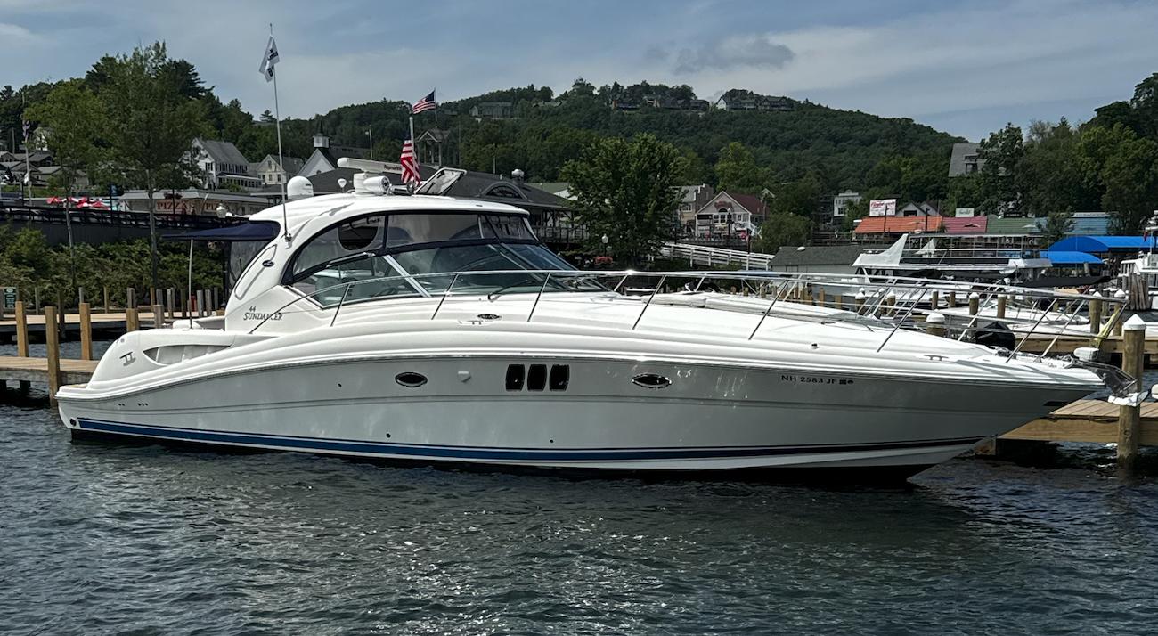 Sea Ray 44 Sundancer 2007 Sea Ray 44 Sundancer yacht docked at a marina with scenic background.