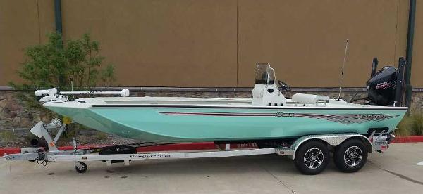 Ranger RB210 2024 Ranger RB210 boat on a trailer, mint green hull, dual-axle trailer.