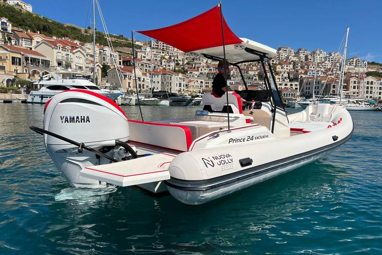 Nuova Jolly PRINCE 24 2025 Nuova Jolly PRINCE 24 boat with Yamaha engine, docked in scenic harbor.