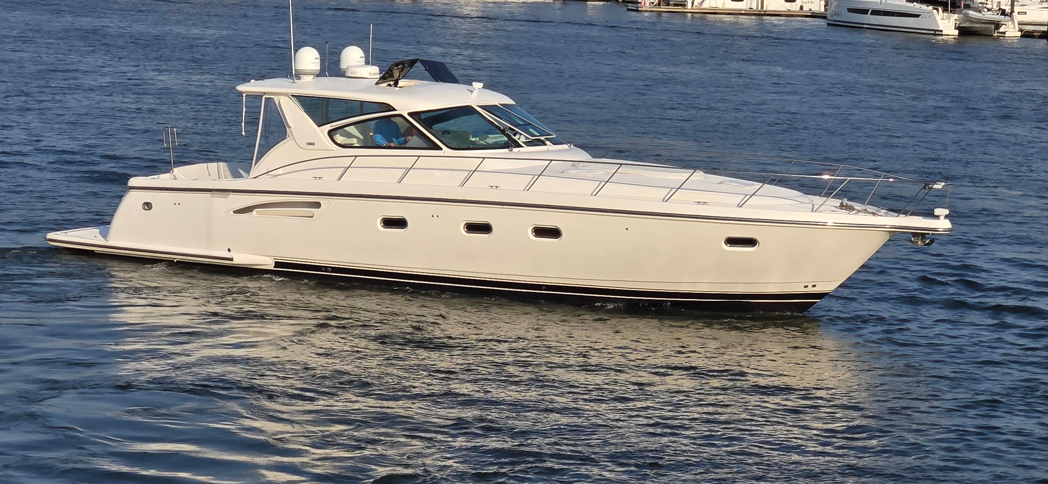 Tiara Yachts 5200 Sovran 2004 Tiara Yachts 5200 Sovran cruising on a calm blue sea.