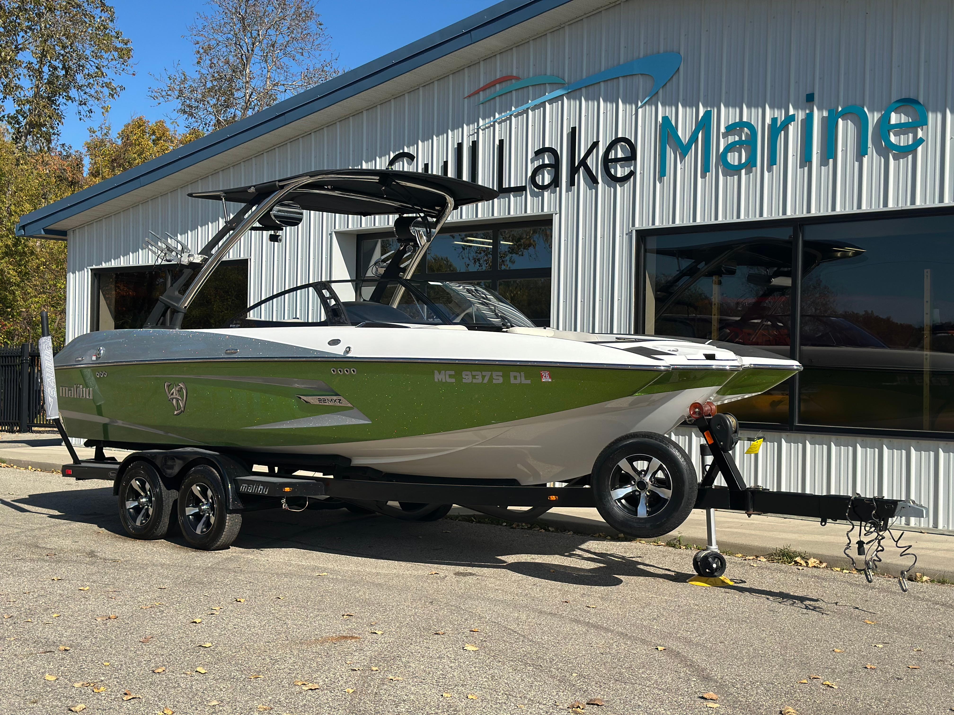Malibu Wakesetter 22 MXZ 2013 Malibu Wakesetter 22 MXZ boat on trailer outside dealership.