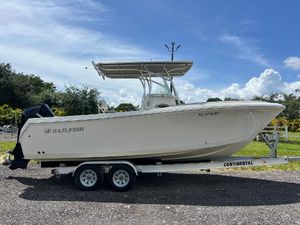 Sailfish 242 CC 2021 Sailfish 242 CC boat on trailer, parked outdoors under a clear sky.
