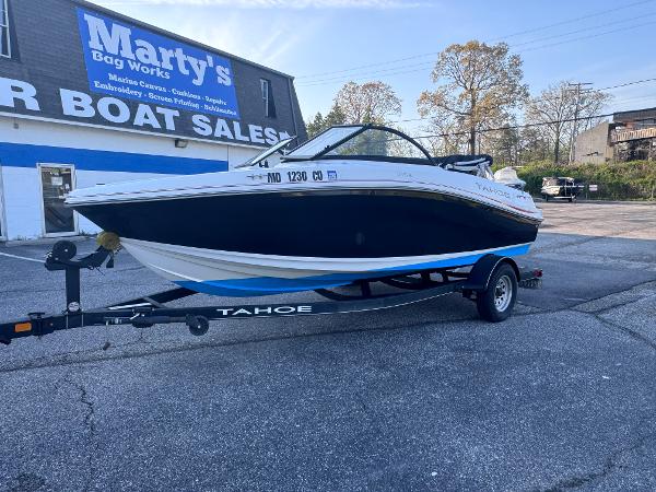 Tahoe 185 S 2022 Tahoe 185 S boat on trailer at Marty's Boat Sales parking lot.