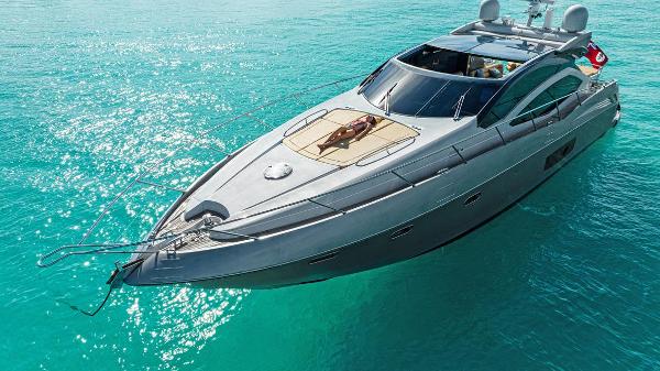 Sunseeker Predator 64 Luxury Sunseeker 64 Predator yacht, 2011 model, cruising on clear turquoise waters.