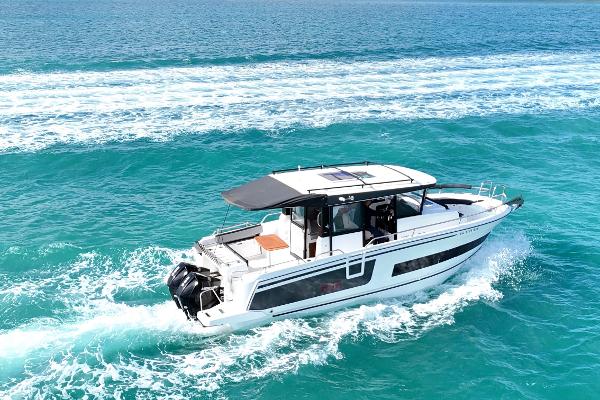 Jeanneau NC Sport 895 2021 Jeanneau NC Sport 895 cruising on turquoise ocean waters.