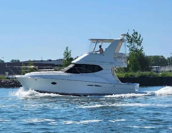 Silverton 34 Convertible 2005 Silverton 34 Convertible yacht cruising on a sunny day.