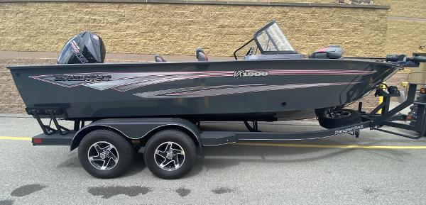 Ranger VX1988 WT 2024 Ranger VX1988 WT boat on trailer, sleek design, dual-axle wheels, outdoor setting.
