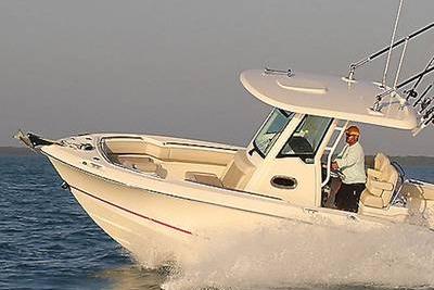Boston Whaler 250 Outrage 2025 Boston Whaler 250 Outrage cruising on open water, showcasing sleek design and performance.