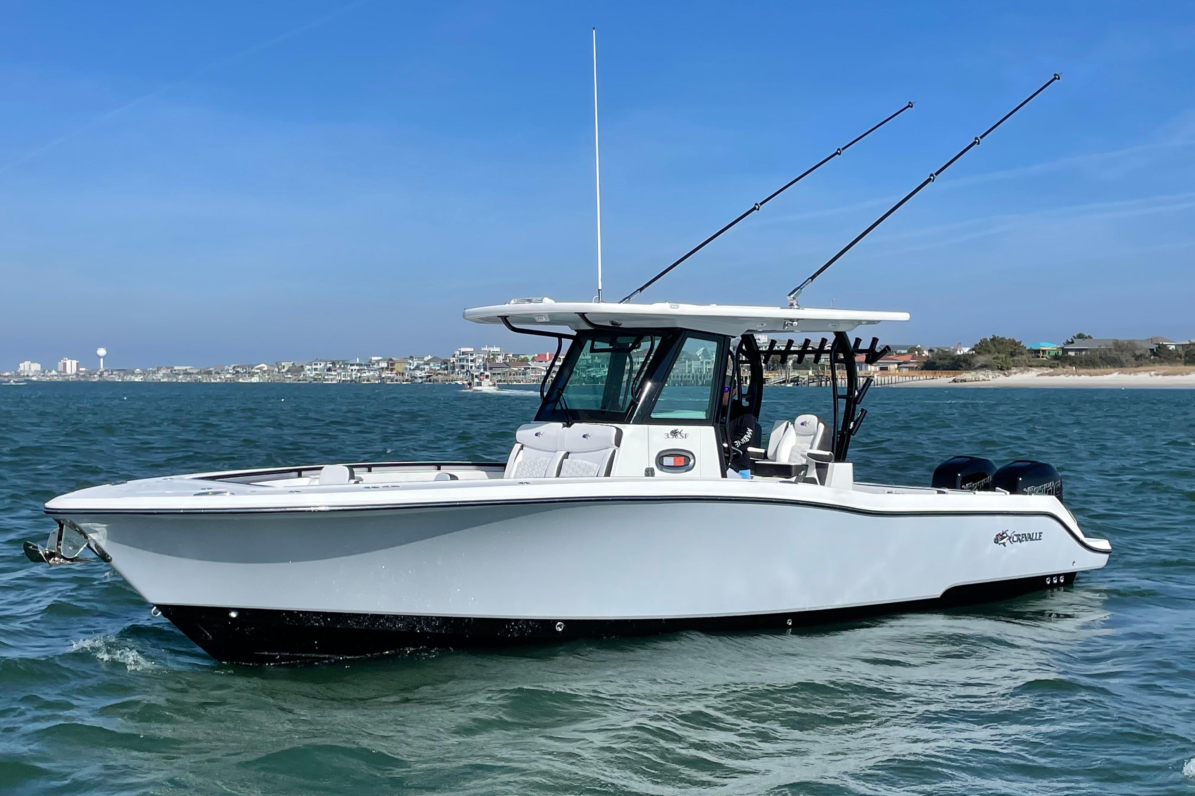 Crevalle 33 CSF 2023 Crevalle 33 CSF boat on water, featuring sleek design and dual engines.