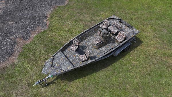 War Eagle 2170 Blackhawk 2025 War Eagle 2170 Blackhawk boat with camouflage design on grass.