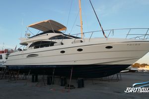 Astondoa 54 2006 Astondoa 54 yacht on dry dock, showcasing sleek design and spacious deck.