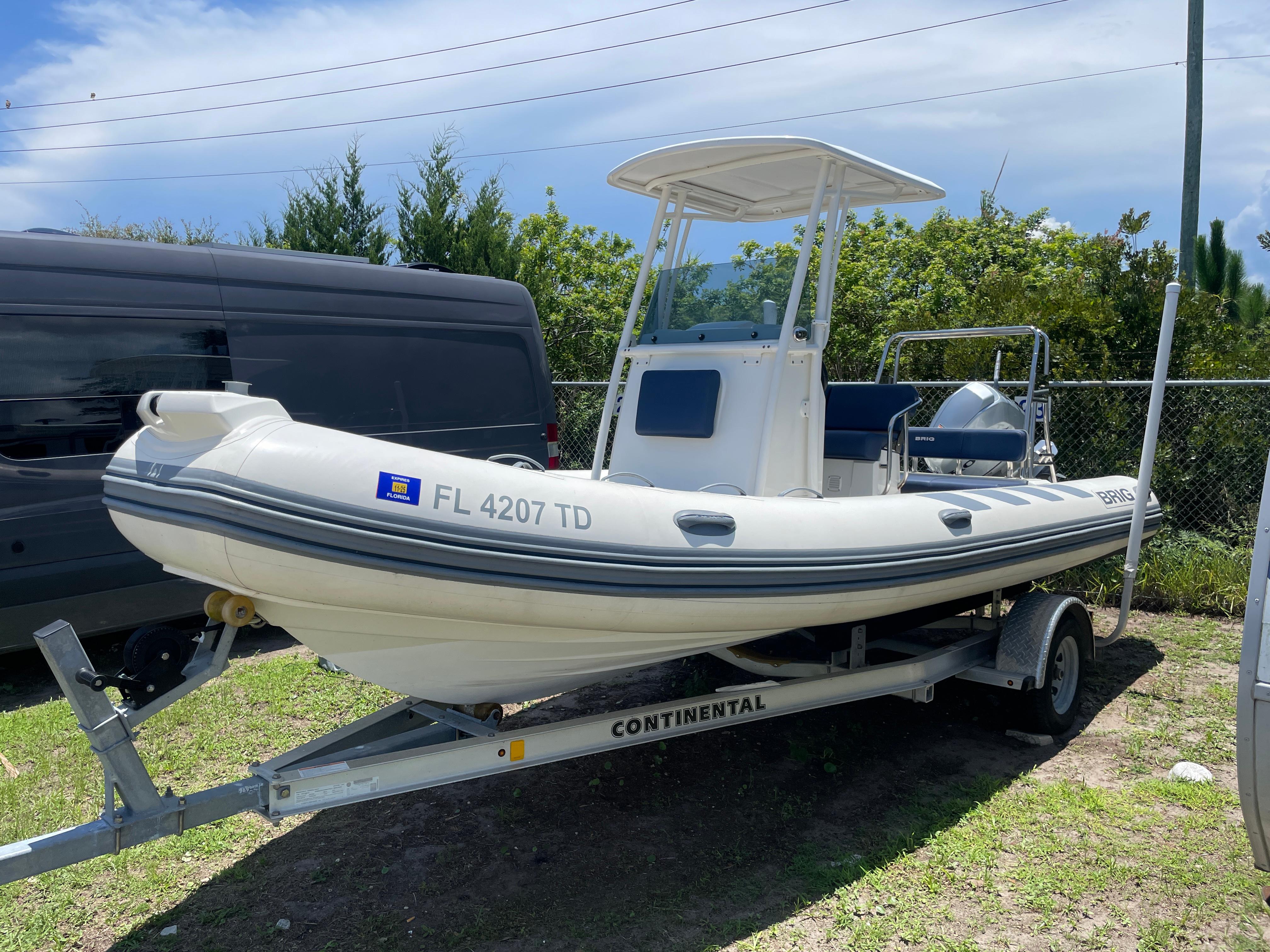 Brig Navigator 610 2022 Brig Navigator 610 boat on trailer, parked outdoors, with Florida registration.