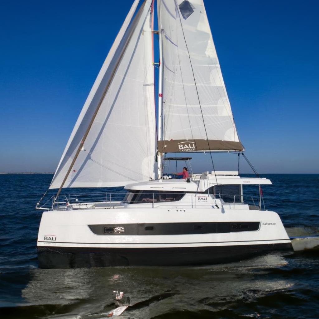 Bali CATSPACE 2021 Bali CATSPACE sailing catamaran on open sea with full sails.