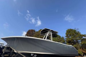 Key West 203 FS 2023 Key West 203 FS boat against a clear blue sky and trees.