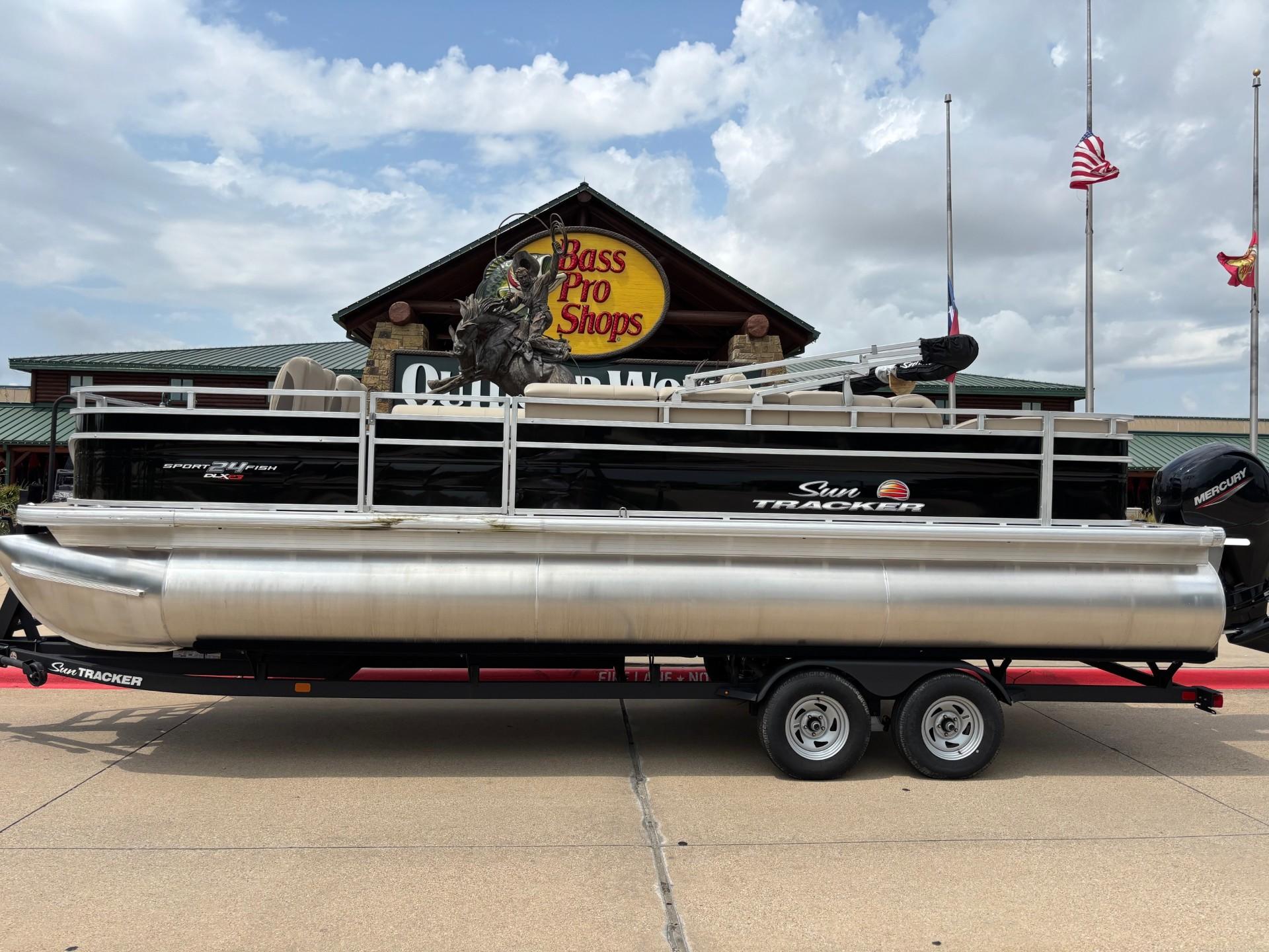 Sun Tracker Sportfish 24 XP3 2025 Sun Tracker Sportfish 24 XP3 pontoon boat displayed at Bass Pro Shops.