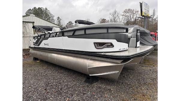 Tahoe Pontoon Sport 85 Quad Lounger 2025 Tahoe Pontoon Sport 85 Quad Lounger, sleek design, parked outdoors on gravel.