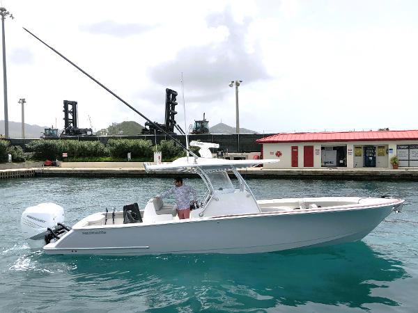 Valhalla Boatworks V-33 2021 Valhalla Boatworks 33 model in a marina with clear blue water.