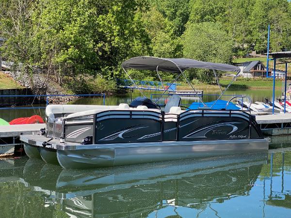 JC Neptoon Sport 23TT 2023 JC Neptoon Sport 23TT pontoon boat docked on a serene lake.