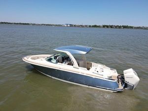 Chris-Craft Launch 31 GT 2023 Chris-Craft Launch 31 GT boat on calm water, showcasing sleek design and luxury features.