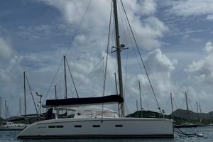 Nautitech 442 - 3 cabins owners version 2008 Nautitech 442 sailboat with three cabins, docked in a marina under cloudy skies.