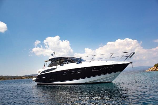 Princess V48 Open 2015 Princess V48 Open yacht on calm water under a clear blue sky.