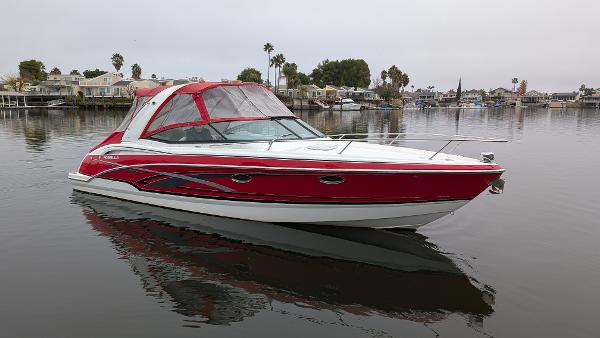 Formula 310 Sun Sport 2008 Formula 310 Sun Sport boat on calm water, red and white design.