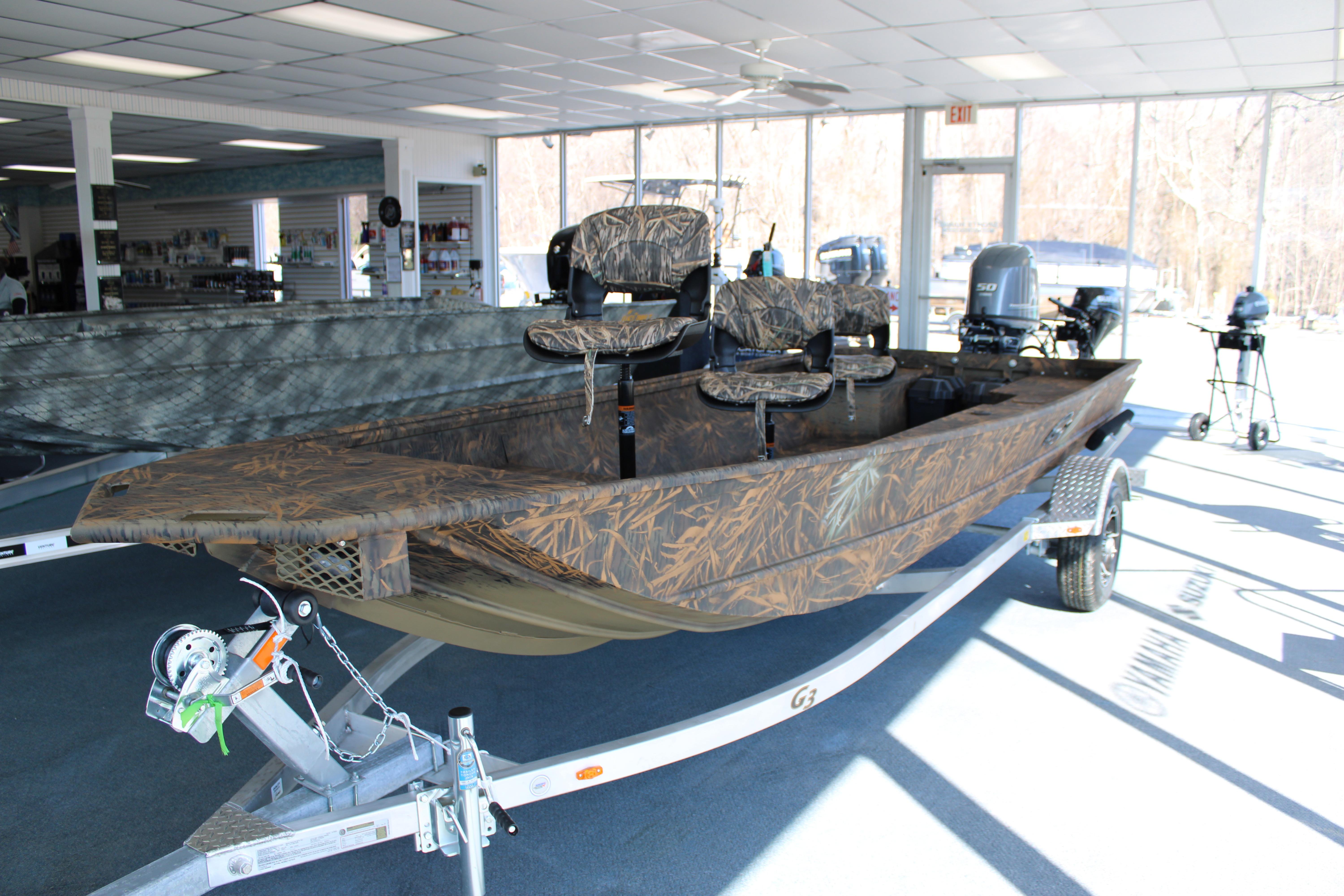 G3 Gator Tough 16 DK 2025 G3 Gator Tough 16 DK boat with camouflage design in showroom.