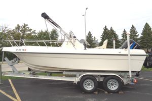 Sea Master 2080 Center Console 2001 Sea Master 2080 Center Console boat on trailer, parked outdoors.