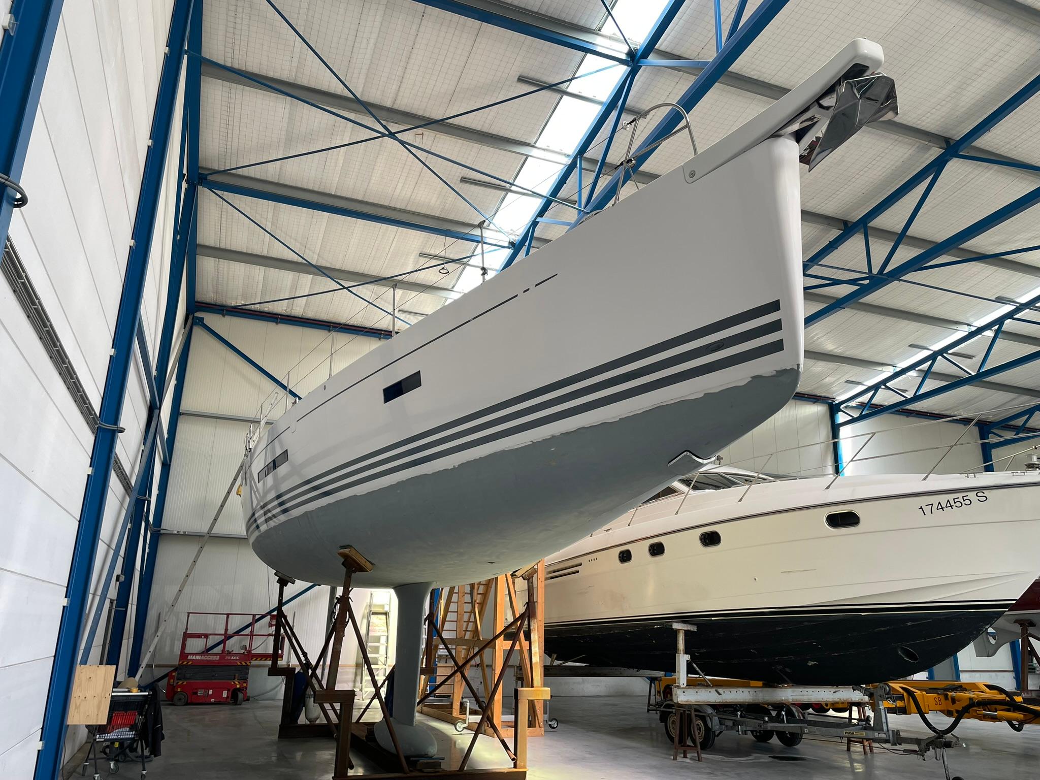 X-Yachts Xp 55 2014 X-Yachts Xp 55 sailboat in a storage facility, elevated on supports.