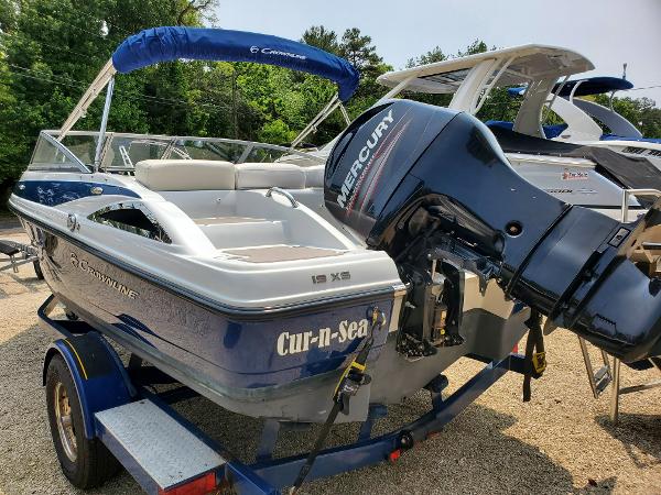 Crownline 19XS 2013 Crownline 19XS boat with Mercury outboard motor on trailer.