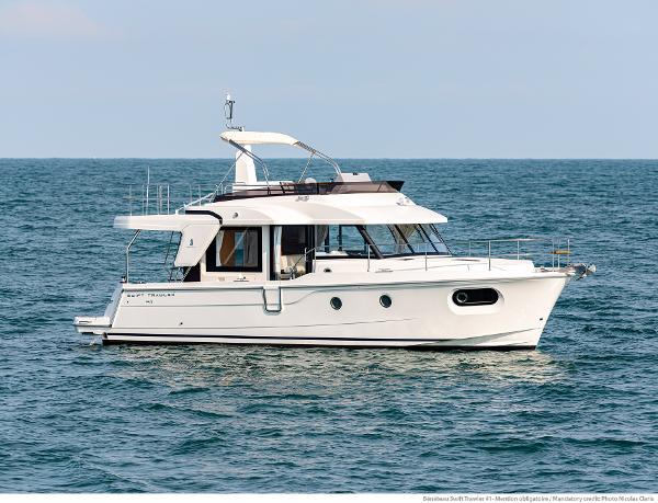 Beneteau Swift Trawler 41 Fly 2026 Beneteau Swift Trawler 41 Fly cruising on open water.