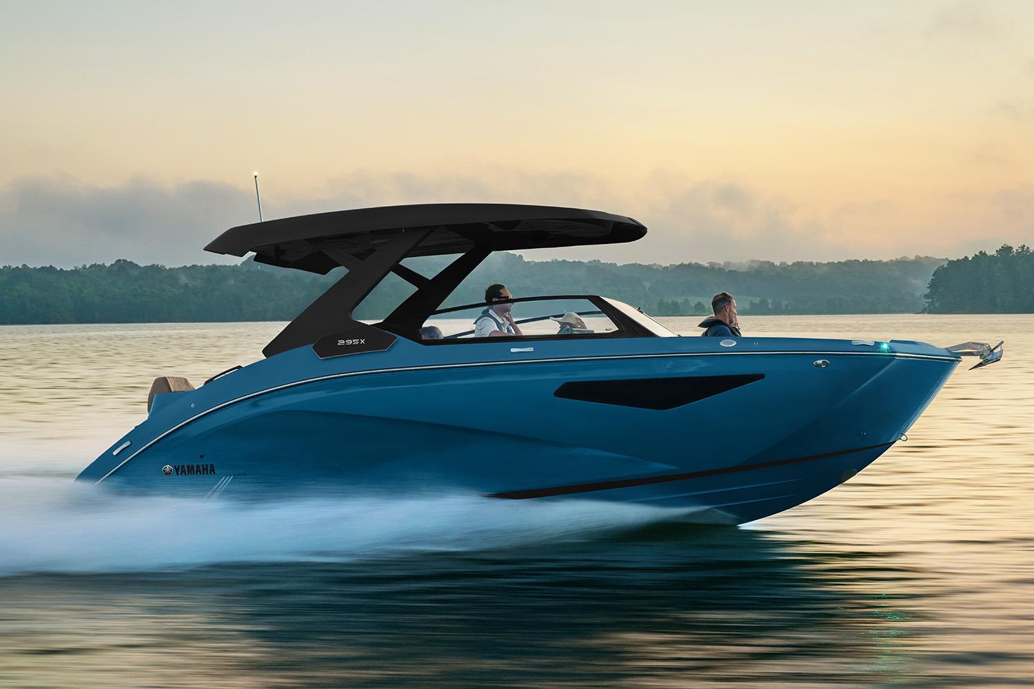 Yamaha Boats 295XD Manufacturer Provided Image: 2026 Yamaha Boats 295XD cruising on a serene lake at sunset.