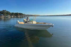 Chris-Craft Catalina 23 2016 Chris-Craft Catalina 23 boat cruising on calm water under clear blue sky.