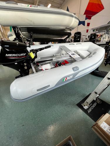 AB Inflatables Lammina 9 AL 2023 AB Inflatables Lammina 9 AL boat with Mercury outboard motor in showroom.